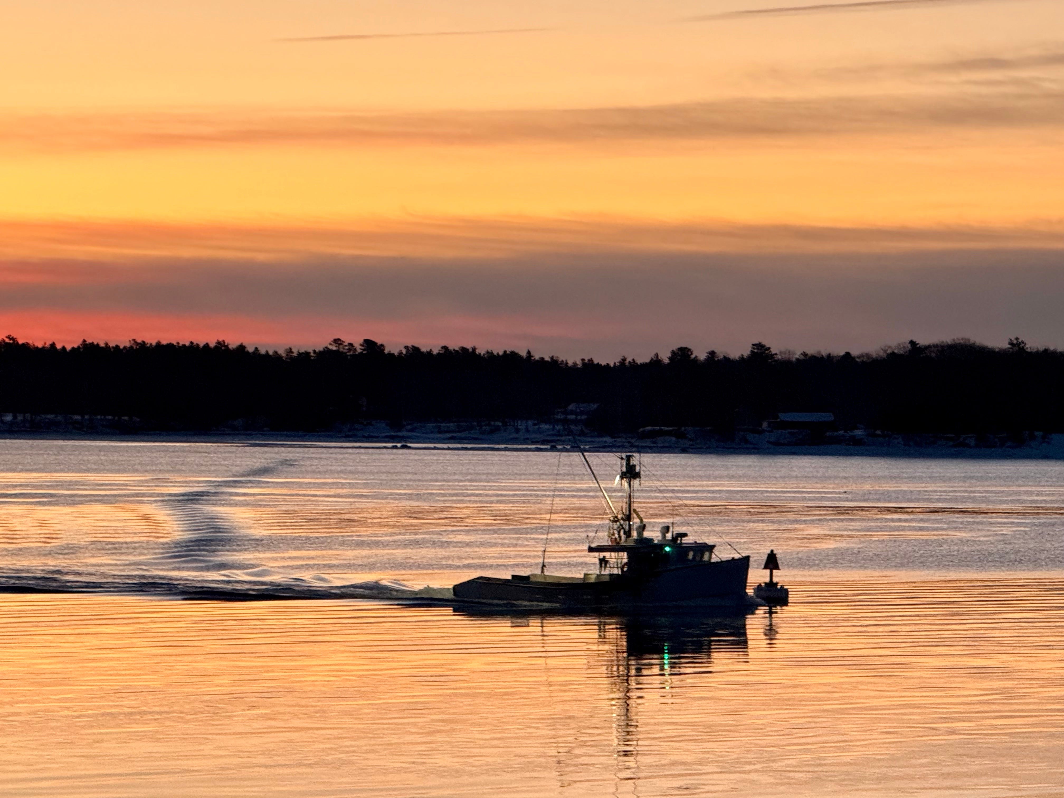 Fishing boat at sunset on the Maine coast, seasonal image for The Bountiful Path