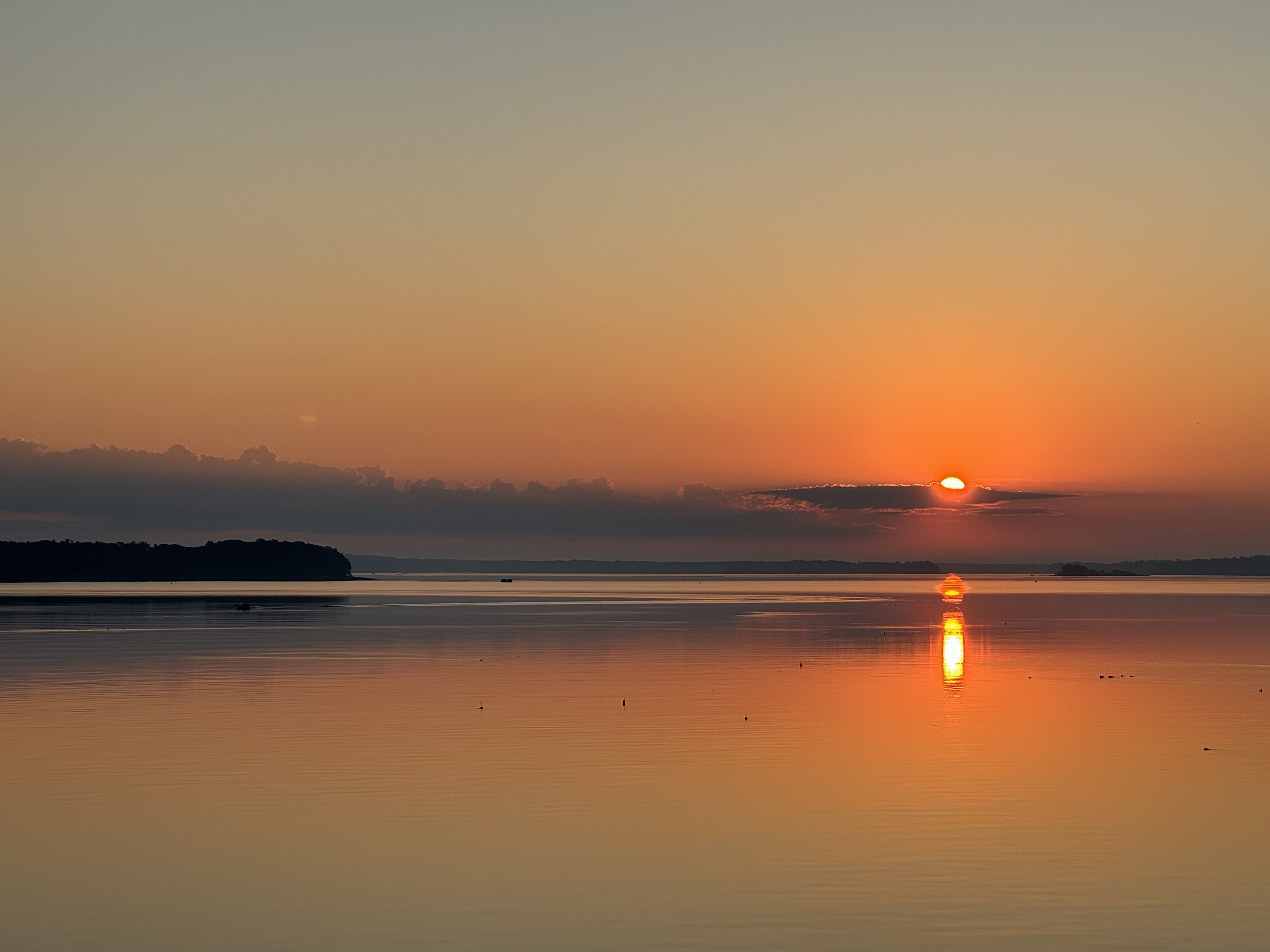 Fishing boat at sunset on the Maine coast